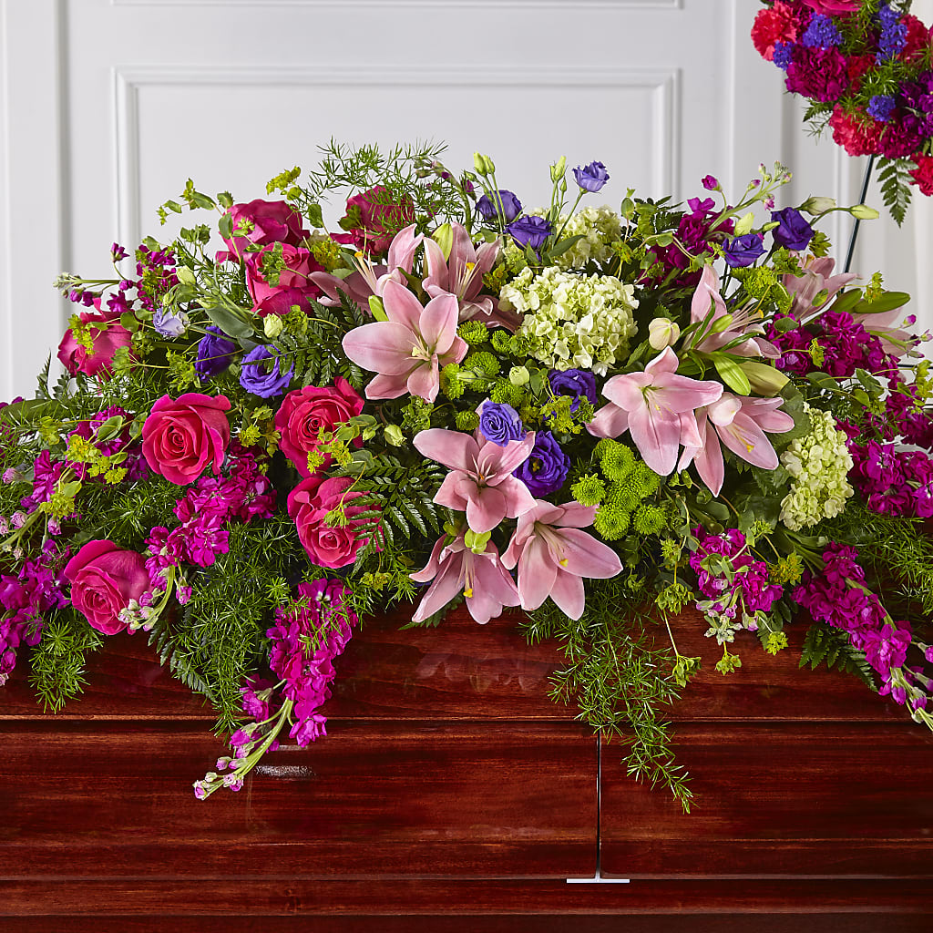 Radiant Tribute Casket Spray – Charming Petals, Dracut MA